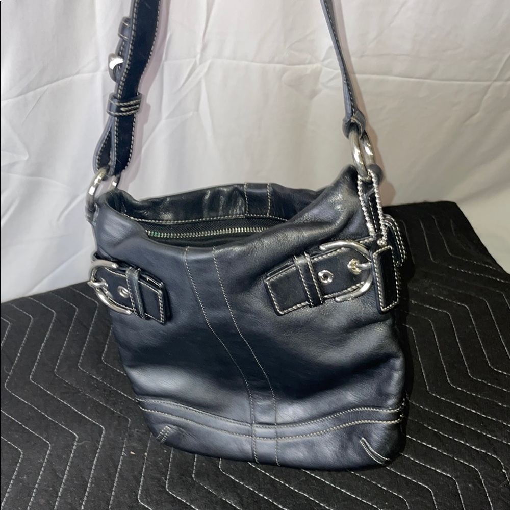 A slouchy hobo- bucket style slim style shoulder bag in Black leather
